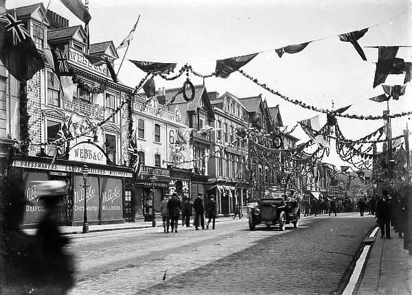 A highly decorated Boscawen Street looking east, Truro, Cornwall. Thought to be 27th May 1913 but possibly earlier
