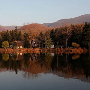 Autumnal foliage is relected on a lake near Belapatfalva