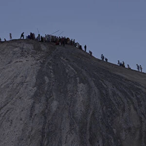 Hindu devotees climb towards the crater of the Chandargup mud volcano in Pakistan s