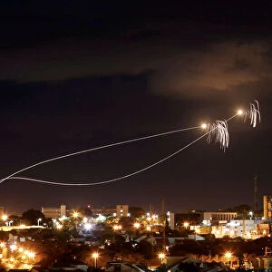 Iron Dome anti-missile system fires interception missiles as rockets are launched