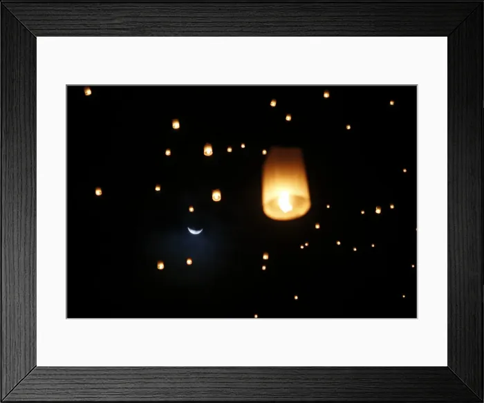 Framed Print : The moon is seen behind lanterns released by survivors, local residents and visitors Framed Print : The moon is seen behind lanterns released by survivors, local residents and visitors