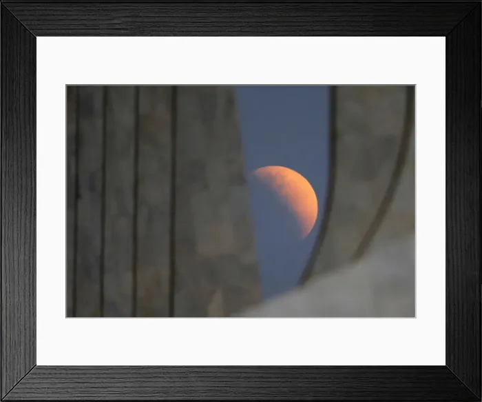 Framed Print : A partial lunar eclipse is seen outside the Planalto Palace in Brasilia Framed Print : A partial lunar eclipse is seen outside the Planalto Palace in Brasilia