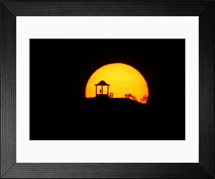 Framed Print : People are silhouetted against the setting sun at El Mirador de la Alemana in Malaga Framed Print : People are silhouetted against the setting sun at El Mirador de la Alemana in Malaga
