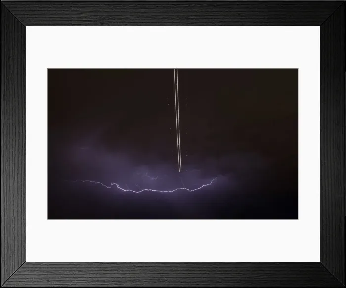 Framed Print : Jet aircraft takes off as lightning strikes across the sky during a monsoon storm Framed Print : Jet aircraft takes off as lightning strikes across the sky during a monsoon storm