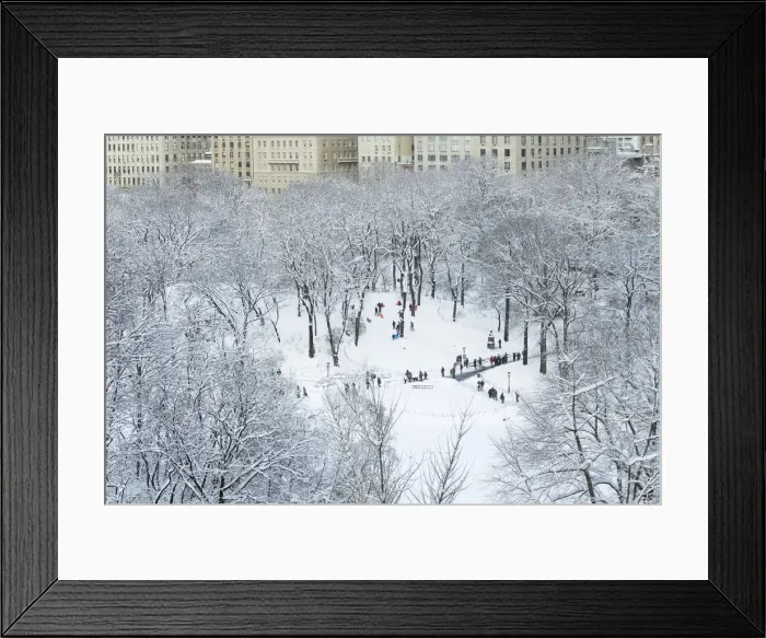 Framed Print : Children sled on a hill inside of Central Park after a snowstorm in New York Framed Print : Children sled on a hill inside of Central Park after a snowstorm in New York