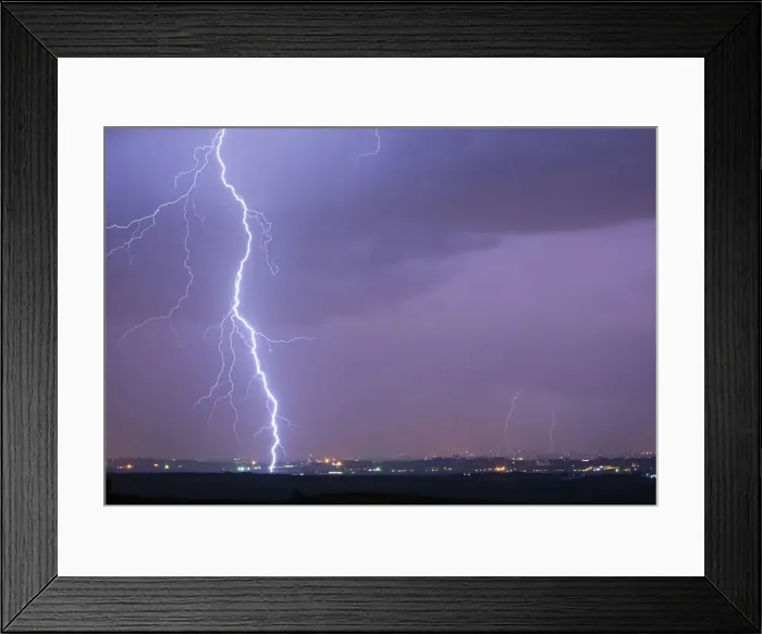 Framed Print : Lightning strikes over Gaza in this general view seen from across the border in southern Framed Print : Lightning strikes over Gaza in this general view seen from across the border in southern