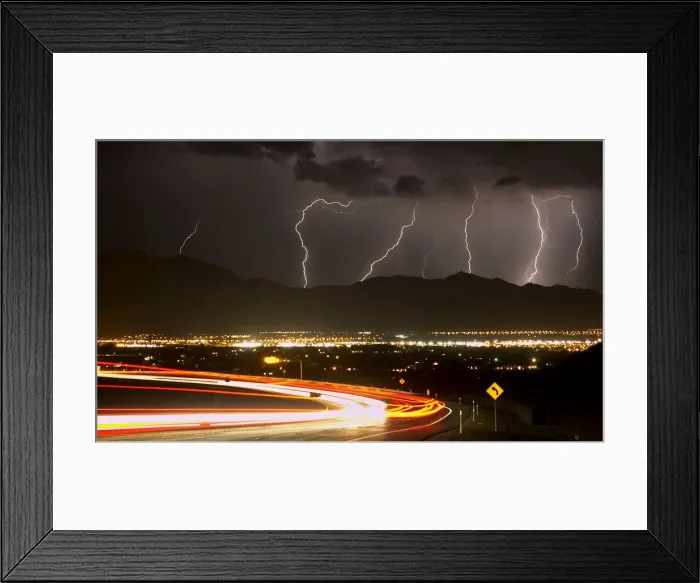 Framed Print : Bolts of lightning and vehicles on Interstate 215 light up northwest Las Vegas