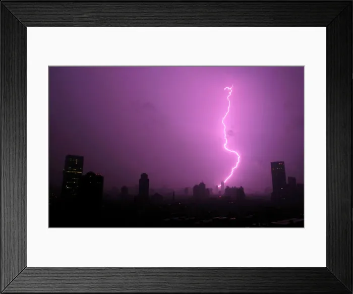 Framed Print : A lightning bolt strikes during a thunderstorm over Shanghai Framed Print : A lightning bolt strikes during a thunderstorm over Shanghai