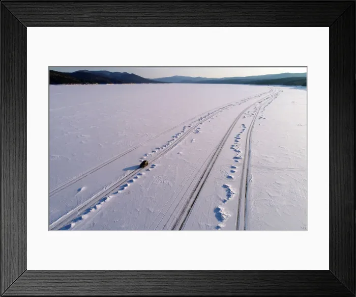 Framed Print : A car drives along a road on the frozen Yenisei River at sunset, south of Krasnoyarsk Framed Print : A car drives along a road on the frozen Yenisei River at sunset, south of Krasnoyarsk