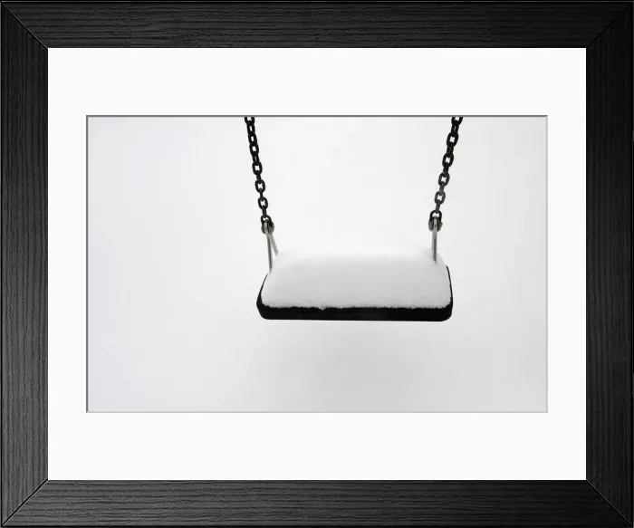 Framed Print : A swing is covered in snow after a snowstorm in the town of Pajares