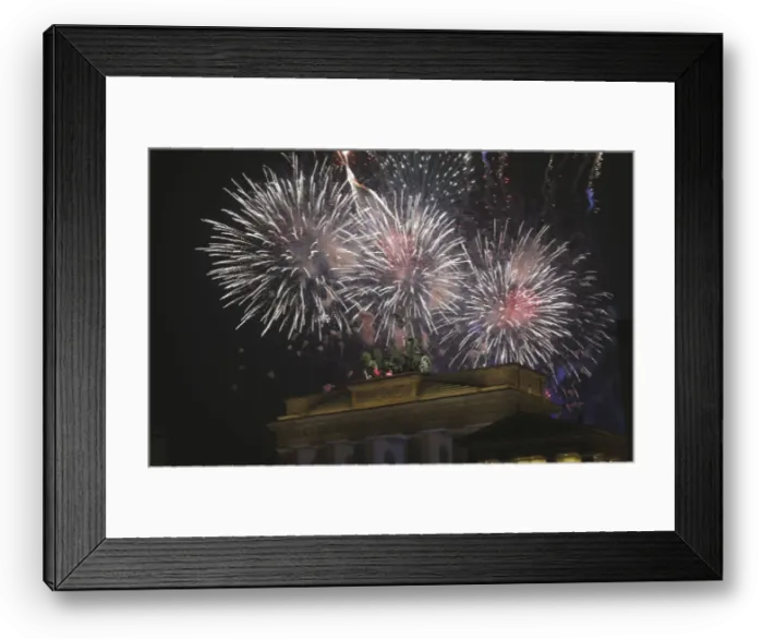 Framed Print : Fireworks explode next to the Quadriga sculpture atop the Brandenburg gate during Framed Print : Fireworks explode next to the Quadriga sculpture atop the Brandenburg gate during
