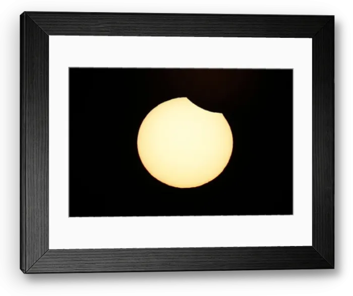 Framed Print : A partial solar eclipse is observed at Coquimbo