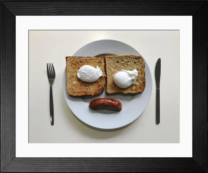 Framed Print : A breakfast of sausage, eggs and toast is pictured in an office canteen in London Framed Print : A breakfast of sausage, eggs and toast is pictured in an office canteen in London