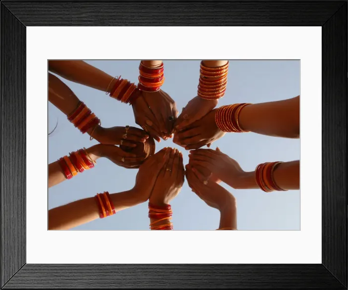 Framed Print : Women devotees pray after taking holy dip in Sangam