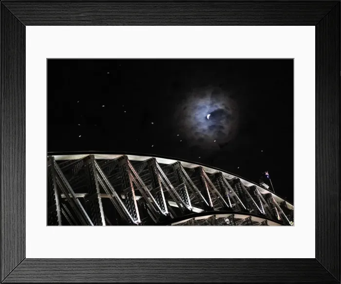 Framed Print : Earths shadow falls on the moon as it undergoes a total lunar eclipse above the Sydney