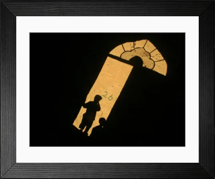 Framed Print : Shadows of Afghan children cast on a wall in the old city of Herat