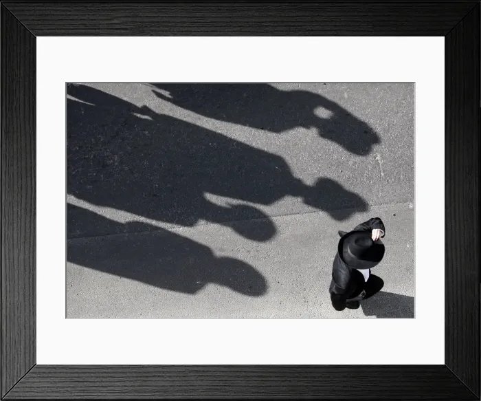 Framed Print : An ultra-Orthodox Jew attends the funeral of Rabbi Menahem Porush in Jerusalem