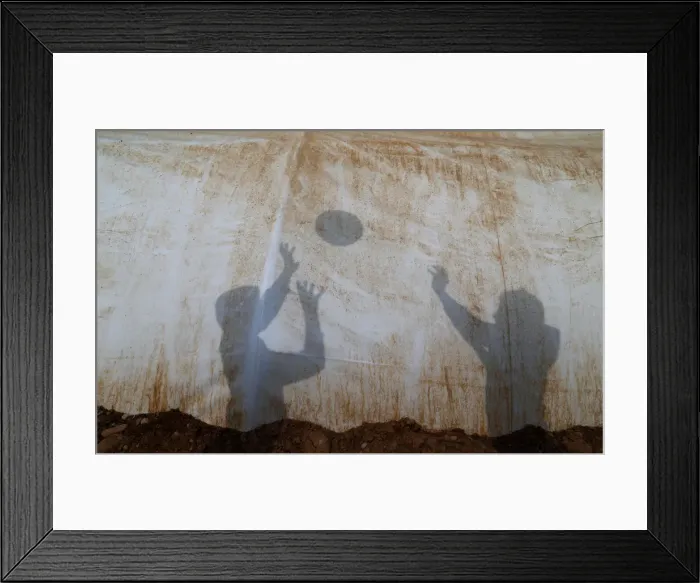 Framed Print : Shadows are cast by displaced Iraqi children, who fled the Islamic State stronghold of Mosul Framed Print : Shadows are cast by displaced Iraqi children, who fled the Islamic State stronghold of Mosul