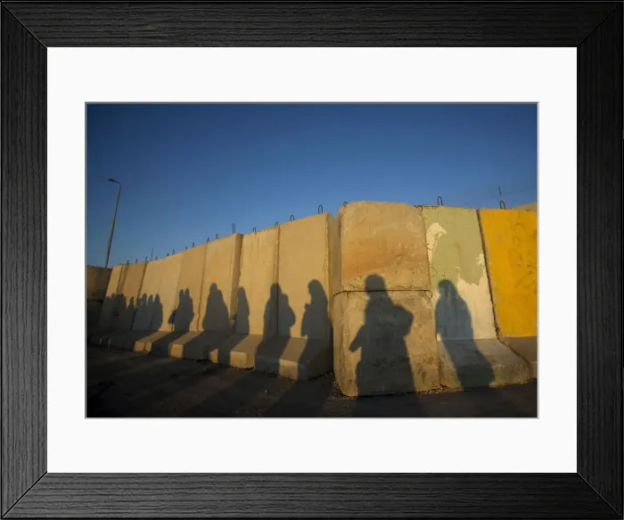 Framed Print : Shadows of Palestinian women are seen at Qalandiya checkpoint outside Ramallah Framed Print : Shadows of Palestinian women are seen at Qalandiya checkpoint outside Ramallah