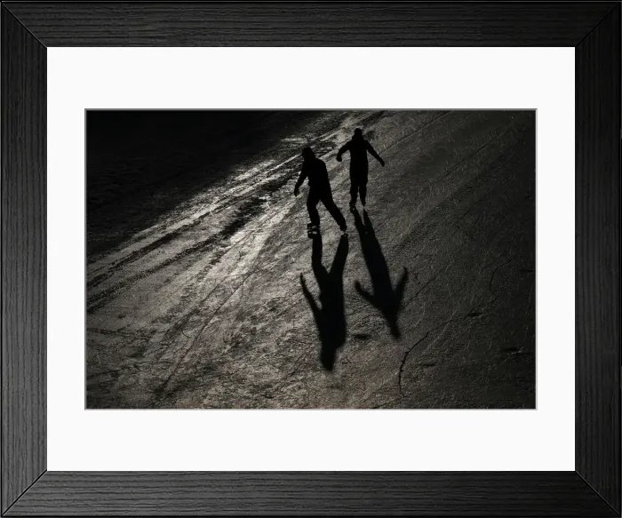 Framed Print : People cast shadows while skating on the Rideau Canal in Ottawa Framed Print : People cast shadows while skating on the Rideau Canal in Ottawa