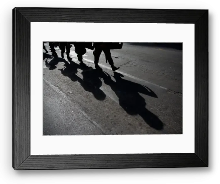 Framed Print : Military policemen cast their shadows as they march toward a protest to mark International Framed Print : Military policemen cast their shadows as they march toward a protest to mark International