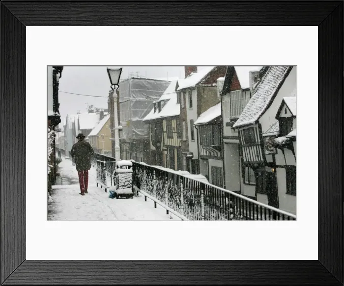 Framed Print : Man braves wintry conditions in Old Hastings in Sussex southern England Framed Print : Man braves wintry conditions in Old Hastings in Sussex southern England