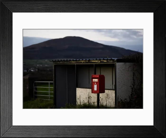 Framed Print : A bus-stop and red post box is seen in the border town of Jonesborough