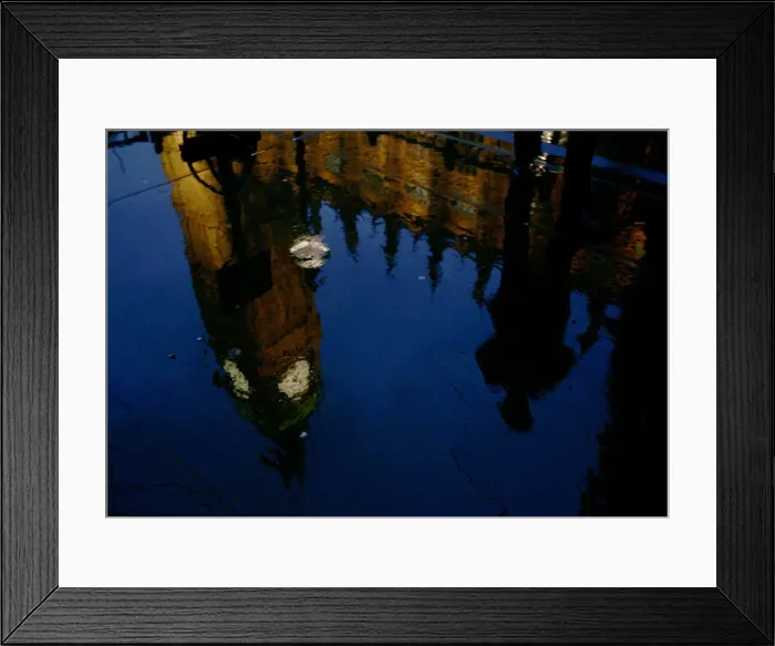 Framed Print : An unidentified Member of Parliament is reflected in a puddle as he hurries into Framed Print : An unidentified Member of Parliament is reflected in a puddle as he hurries into