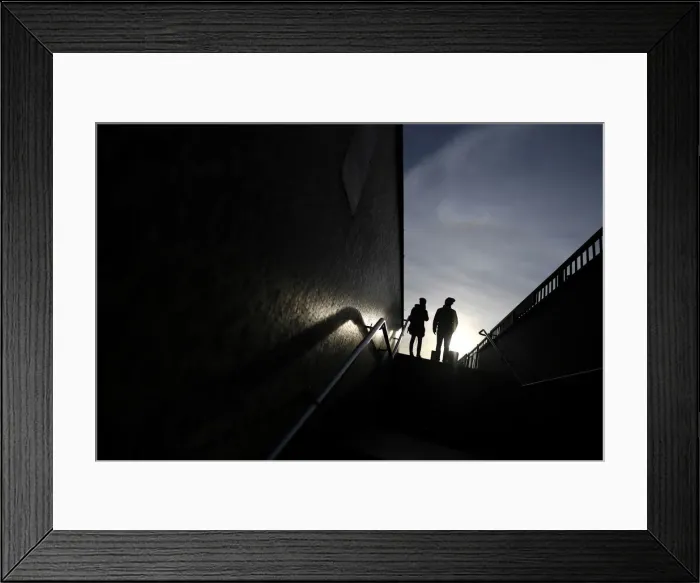 Framed Print : Two people stand at the top of a flight of steps that lead on to London Bridge, in London Framed Print : Two people stand at the top of a flight of steps that lead on to London Bridge, in London