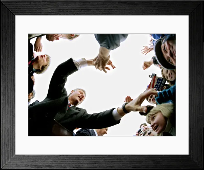 Framed Print : Democratic presidential candidate Bill Clinton reaches into the crowd during a campaign