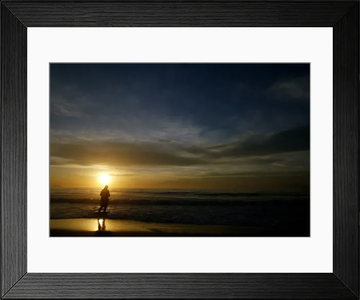 Framed Print : Worshipper tosses floral offering for Goddess of the sea, during sunrise on Copacabana