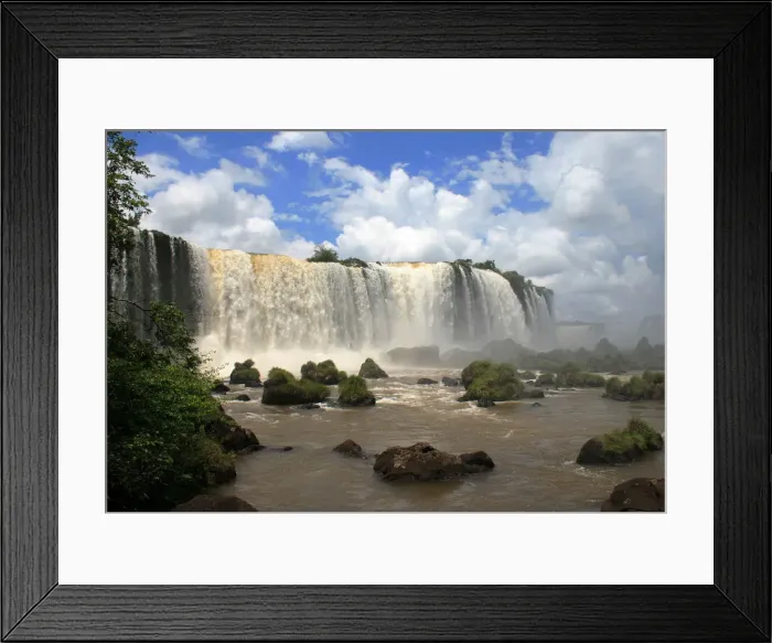 Framed Print : View of the Iguazu Falls from the Brazilian side of the Iguazu River that delimits Framed Print : View of the Iguazu Falls from the Brazilian side of the Iguazu River that delimits