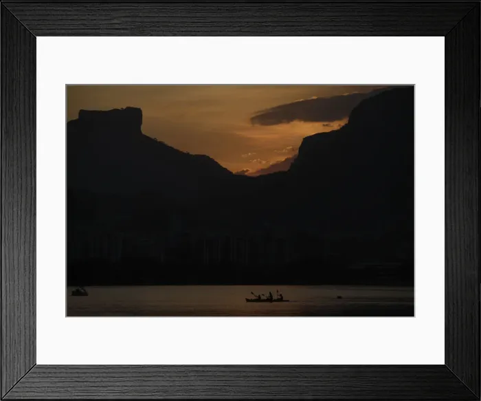 Framed Print : People paddle their canoe at Rodrigo de Freitas Lagoon as the sun sets in Rio de Janeiro Framed Print : People paddle their canoe at Rodrigo de Freitas Lagoon as the sun sets in Rio de Janeiro