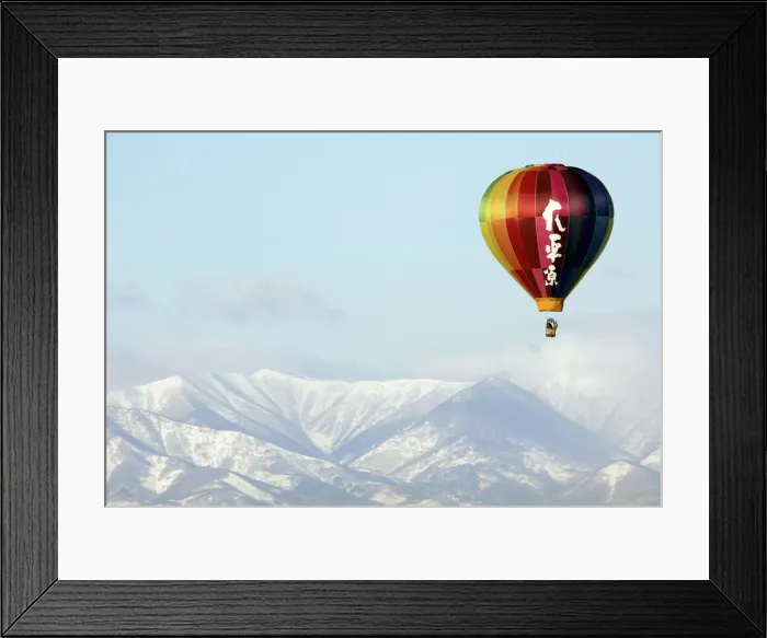 Framed Print : A hot air balloon flies over Obihiro, northern Japan Framed Print : A hot air balloon flies over Obihiro, northern Japan