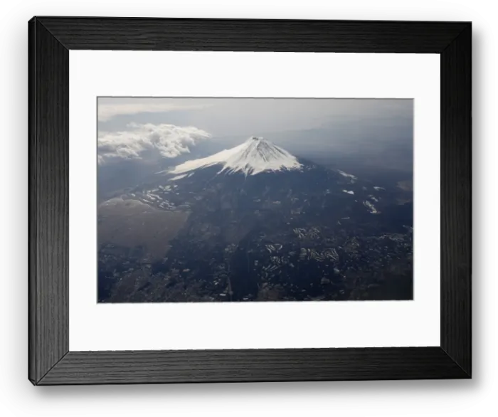 Framed Print : Japans Mount Fuji is seen covered with snow from an airplane Framed Print : Japans Mount Fuji is seen covered with snow from an airplane