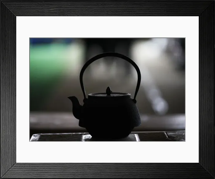 Framed Print : Tea is brewed in a traditional Japanese tea pot at a collective centre for evacuees