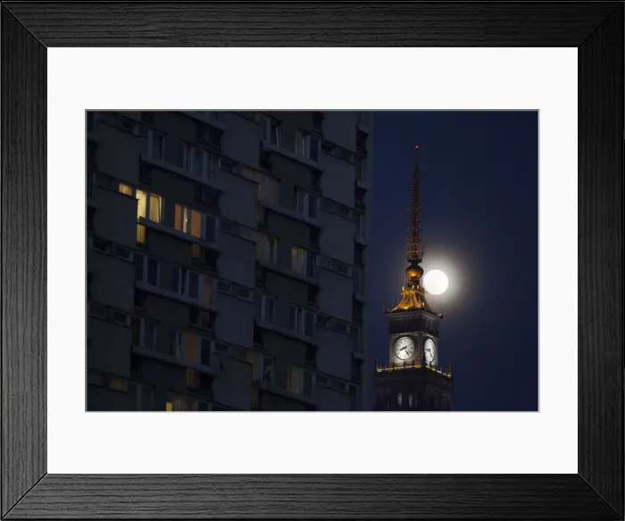Framed Print : The moon is seen above the Palace of Culture and Science in the center of Warsaw Framed Print : The moon is seen above the Palace of Culture and Science in the center of Warsaw