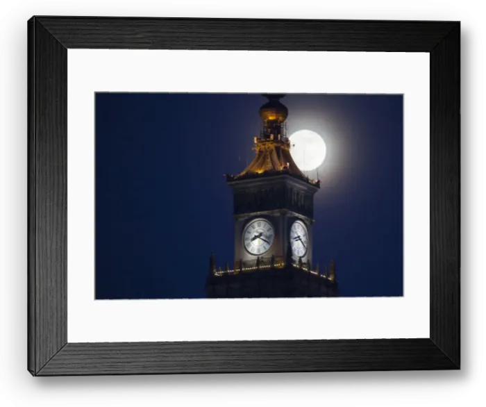 Framed Print : The moon is seen above the Palace of Culture and Science in the center of Warsaw