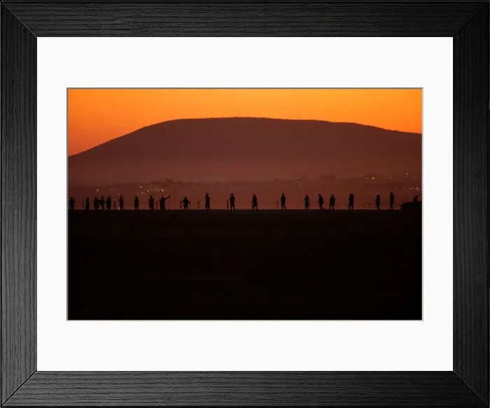 Framed Print : Volunteers wade across the lagoon at dawn to gather flamingo chicks and place them