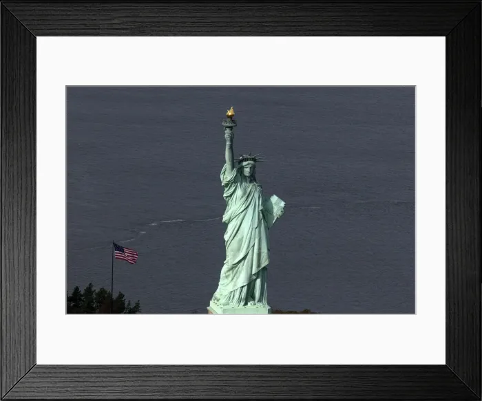 Framed Print : The Statue of Liberty is seen from this aerial view after Liberty Island was hit by Framed Print : The Statue of Liberty is seen from this aerial view after Liberty Island was hit by