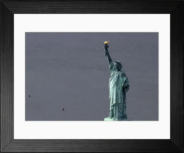 Framed Print : The Statue of Liberty is seen from this aerial view after Liberty Island was hit by Framed Print : The Statue of Liberty is seen from this aerial view after Liberty Island was hit by