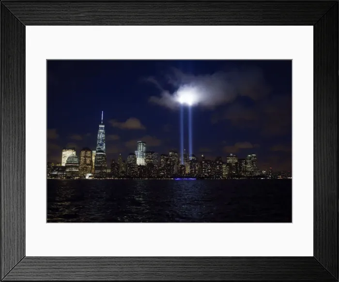 Framed Print : Tribute in Light is illuminated on the skyline of lower Manhattan during events marking