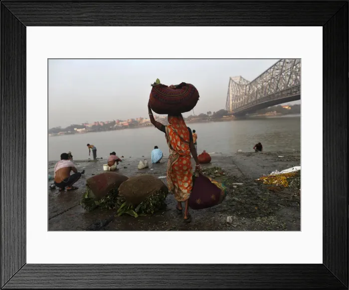 Framed Print : A woman carries sacks of leaves, which will be used to decorate flower bouquets, to Framed Print : A woman carries sacks of leaves, which will be used to decorate flower bouquets, to