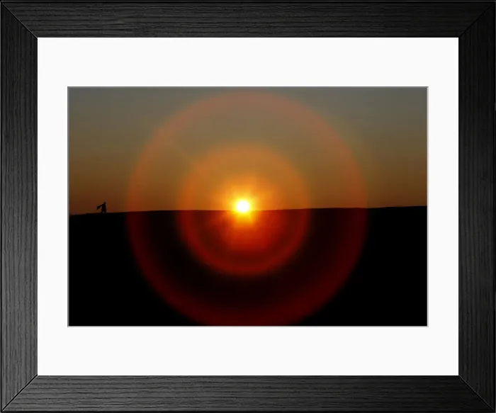 Framed Print : Person is silhouetted as they carry kite during sunset in Berlin Framed Print : Person is silhouetted as they carry kite during sunset in Berlin