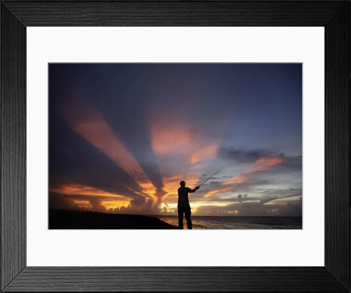 Framed Print : A fisherman casts his line as the sun sets on the outskirts of Havana Framed Print : A fisherman casts his line as the sun sets on the outskirts of Havana
