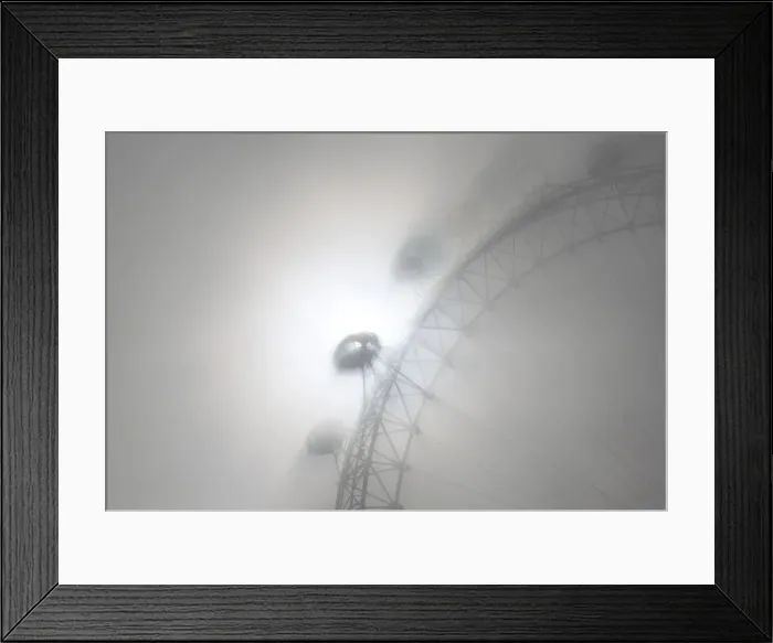 Framed Print : The pods on the London Eye casts shadows against a thick morning fog as the spring Framed Print : The pods on the London Eye casts shadows against a thick morning fog as the spring