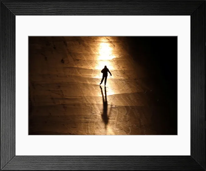 Framed Print : A person casts a shadow while skating on the Rideau Canal in Ottawa Framed Print : A person casts a shadow while skating on the Rideau Canal in Ottawa
