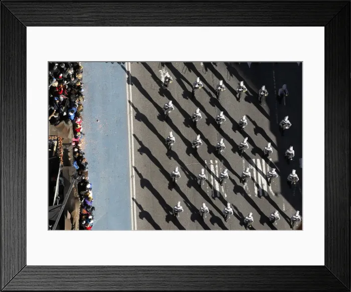 Framed Print : A marching band makes their way through Times Square during the 85th Macys Thanksgiving Framed Print : A marching band makes their way through Times Square during the 85th Macys Thanksgiving