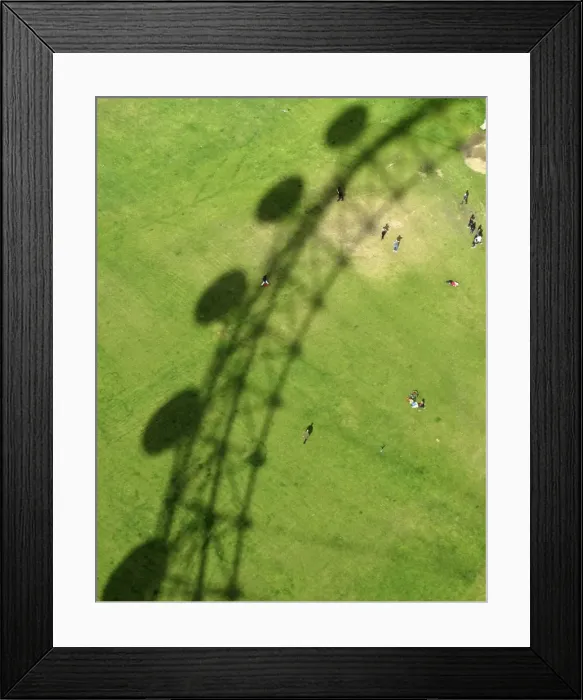 Framed Print : The London Eye casts a shadow on Jubilee Gardens in London Framed Print : The London Eye casts a shadow on Jubilee Gardens in London