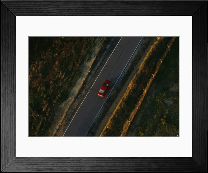 Framed Print : A car travels on a road near Donana Natural Reserve, southwest Spain